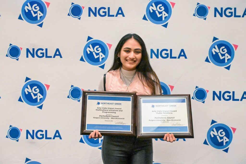student holding ngla award