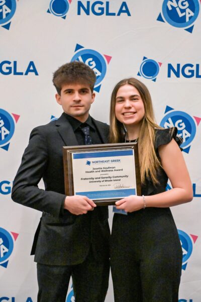 two students holding ngla award